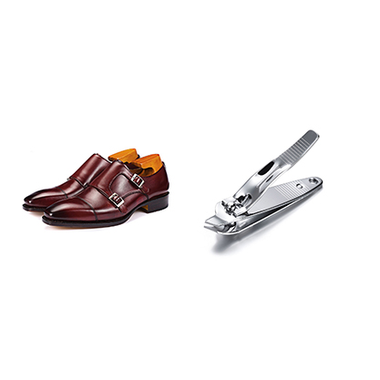 men shoes and nail cutter retouching